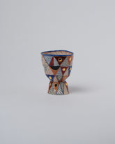 Suzanne Sullivan Two Arrange In Any Sequence Goblet on light color background.