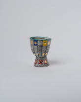 Suzanne Sullivan Four Arrange In Any Sequence Goblet on light color background.