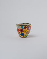 Suzanne Sullivan One Endless Landscape Blossom Tumbler on light color background.