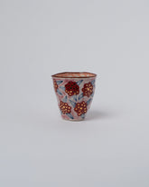 Suzanne Sullivan Two Endless Landscape Blossom Tumbler on light color background.