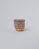 Suzanne Sullivan Three Endless Landscape Blossom Tumbler on light color background.