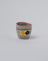 Suzanne Sullivan Four Endless Landscape Blossom Tumbler on light color background.