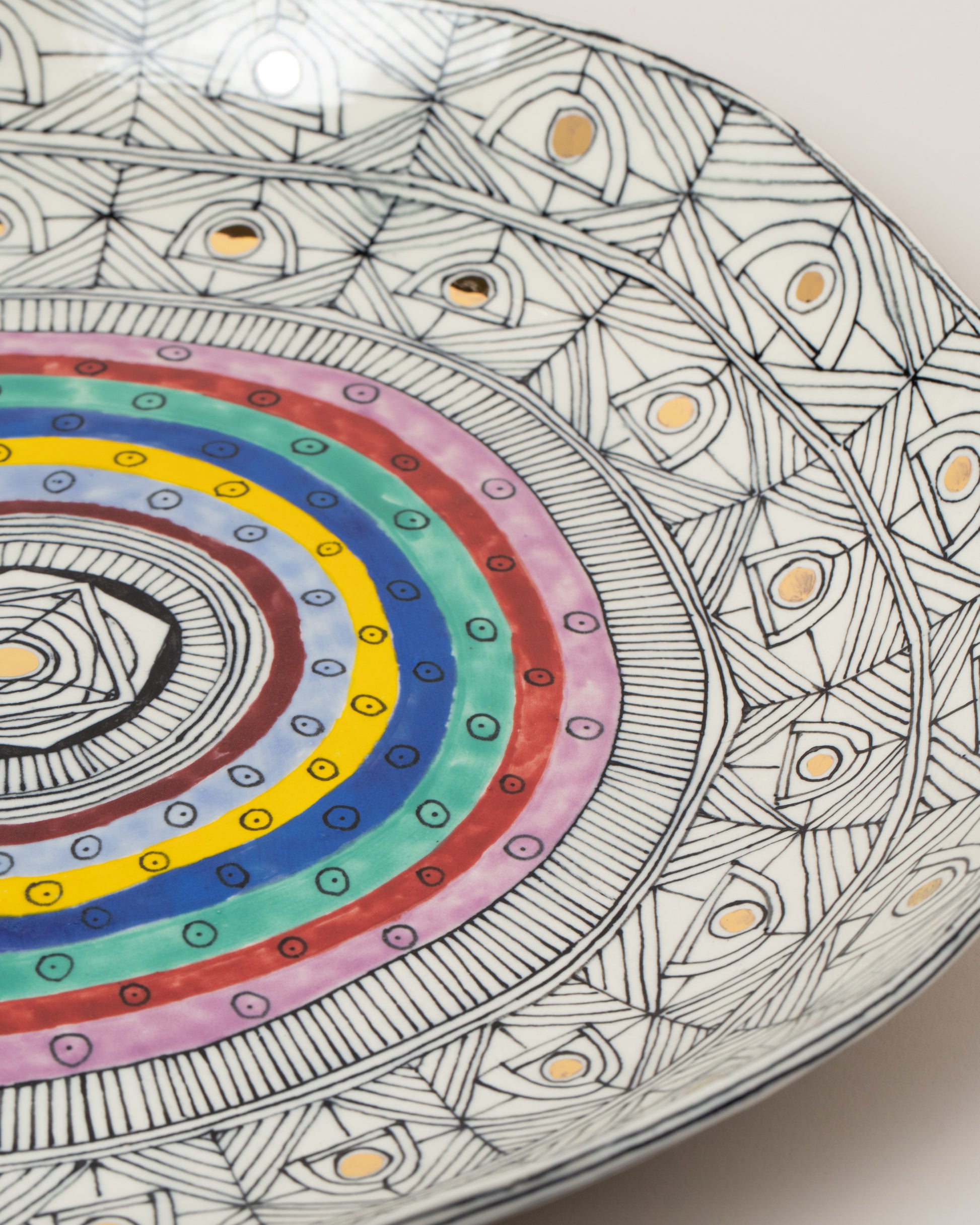 Closeup details of the Suzanne Sullivan Frantically Seeking Happiness Platter on light color background.