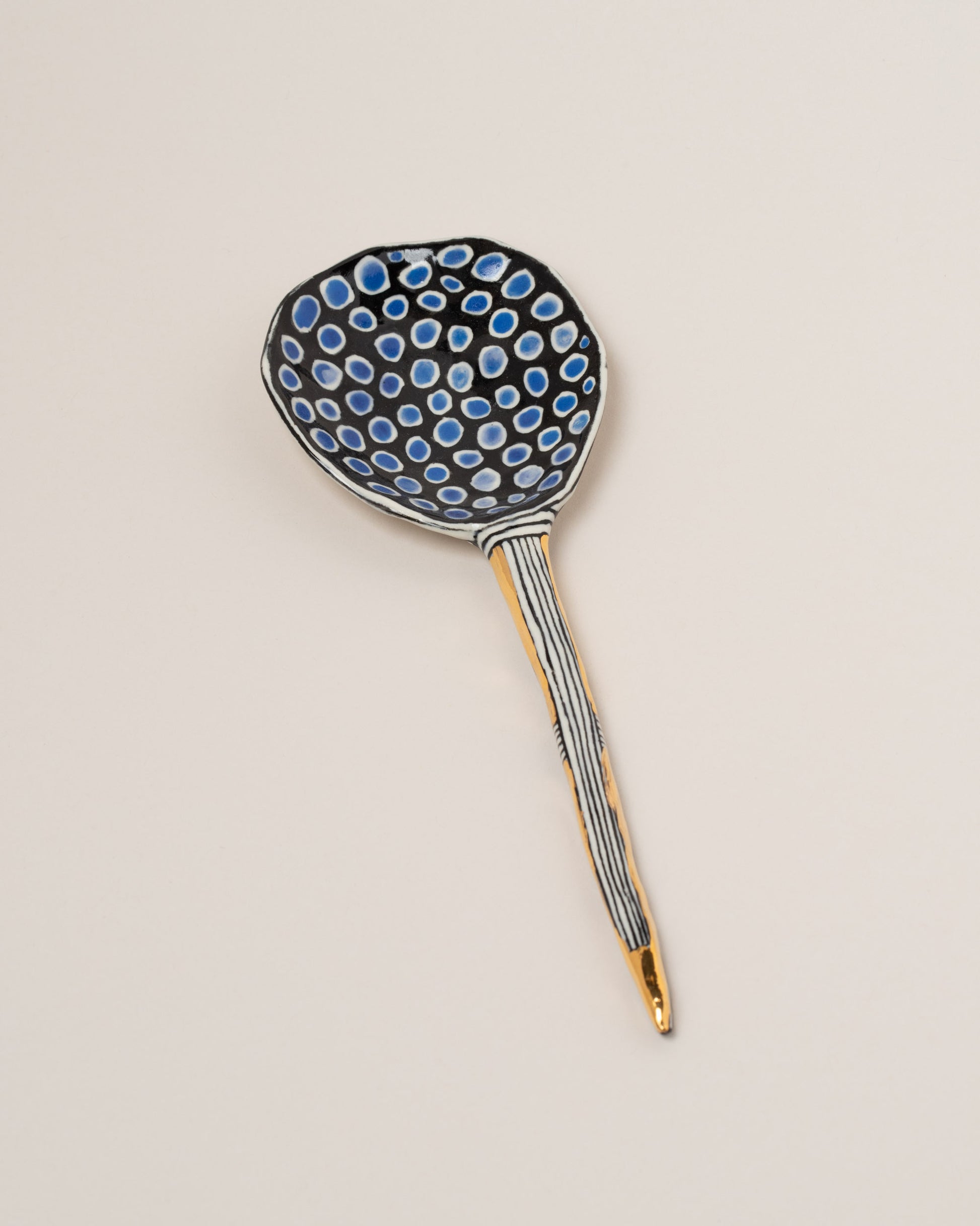 Suzanne Sullivan One I Can Promise 8.5" Spoon on light color background.