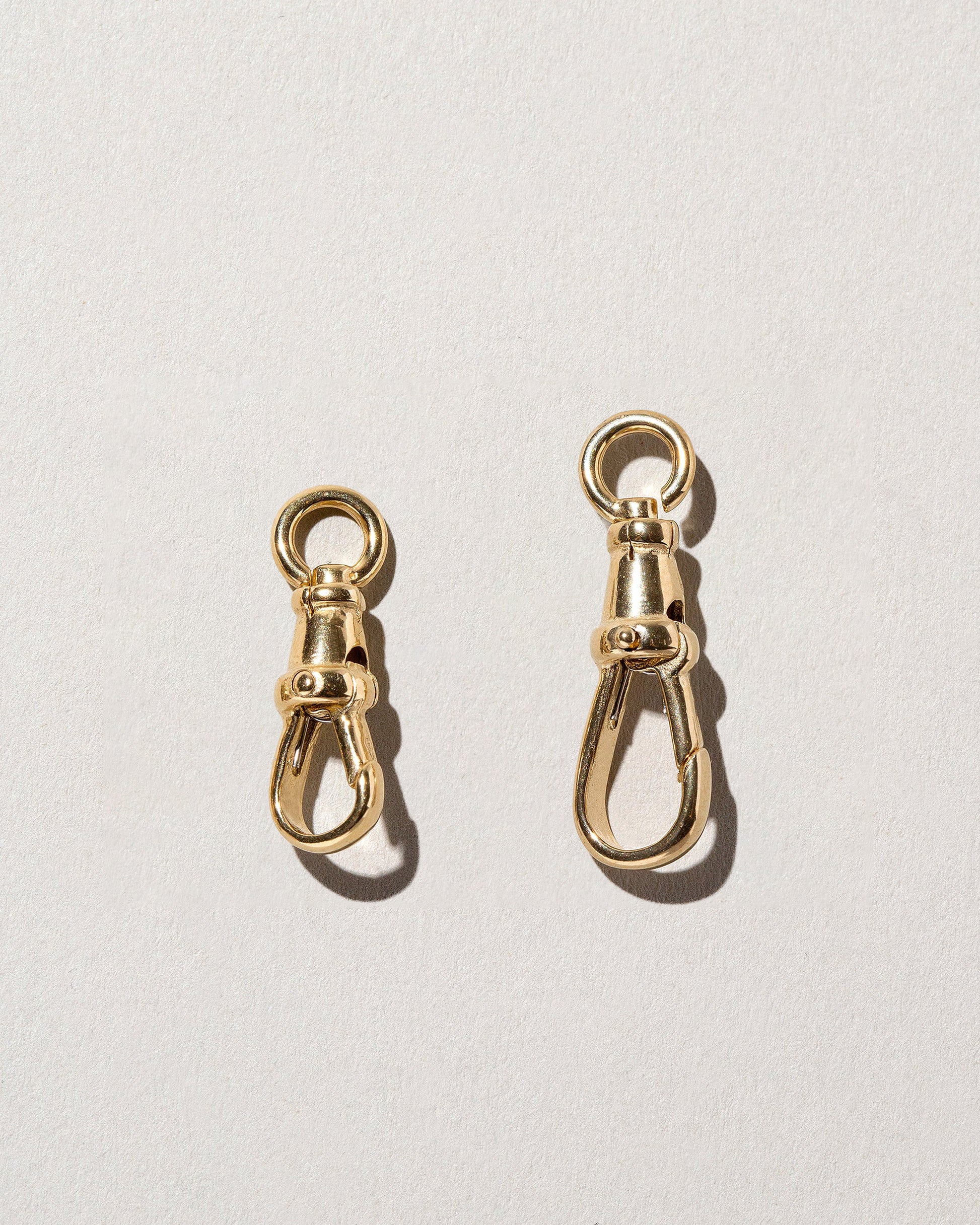 Closeup details of the Swivel Fob and Grand Swivel Fob on light color background.