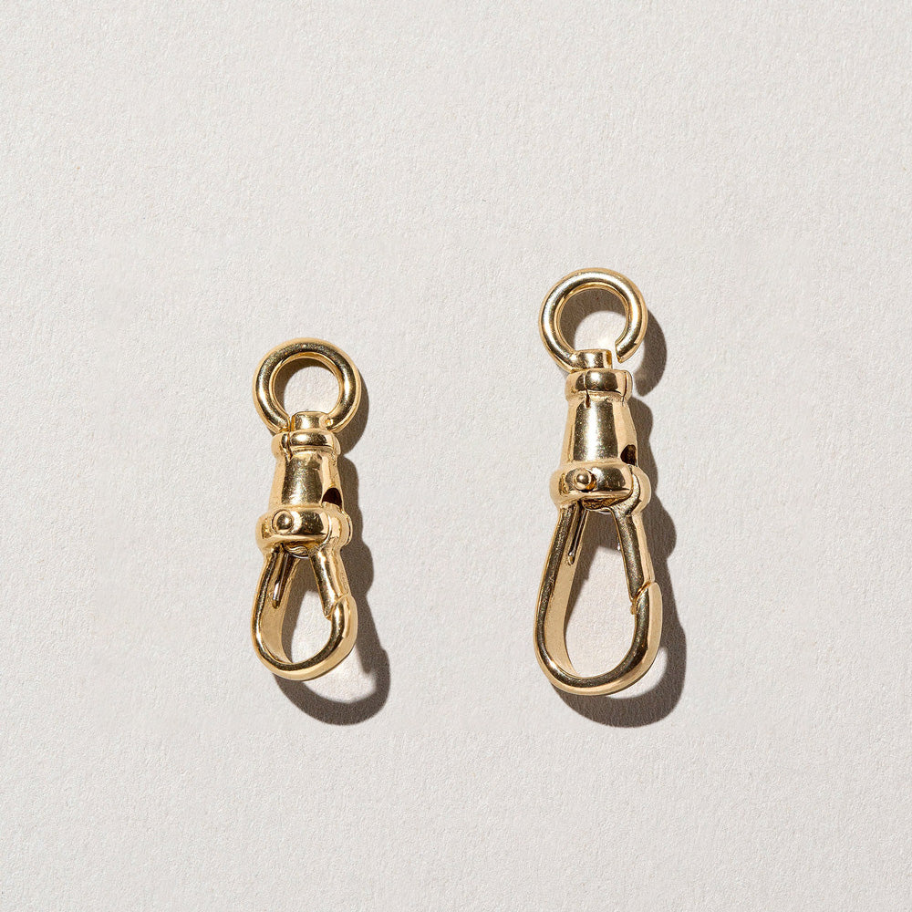 product_details::Closeup details of the Swivel Fob and Grand Swivel Fob on light color background.