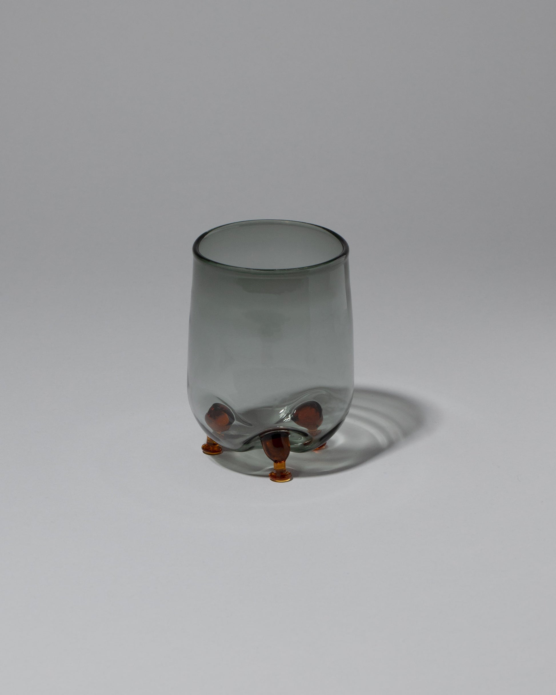 Ornamental by Lameice Gray & Amber Transparent Eye Candy Cocktail Glass on light color background.