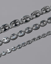 Closeup details of the CRZM Sterling Silver Yuba Mini Bracelet, Sterling Silver Yuba Medium Bracelet, and Sterling Silver Yuba Bracelet on light color background.