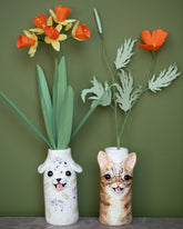 Styled image featuring the The Green Vase Paper Daffodil Stem and Paper California Poppy Stem, with the Katie Kimmel For Your Pleasure Ripley Cat Vase and Tessa Cat Vase.