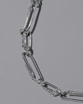 Closeup details of the CRZM Sterling Silver Ophiolite Bracelet on light color background.