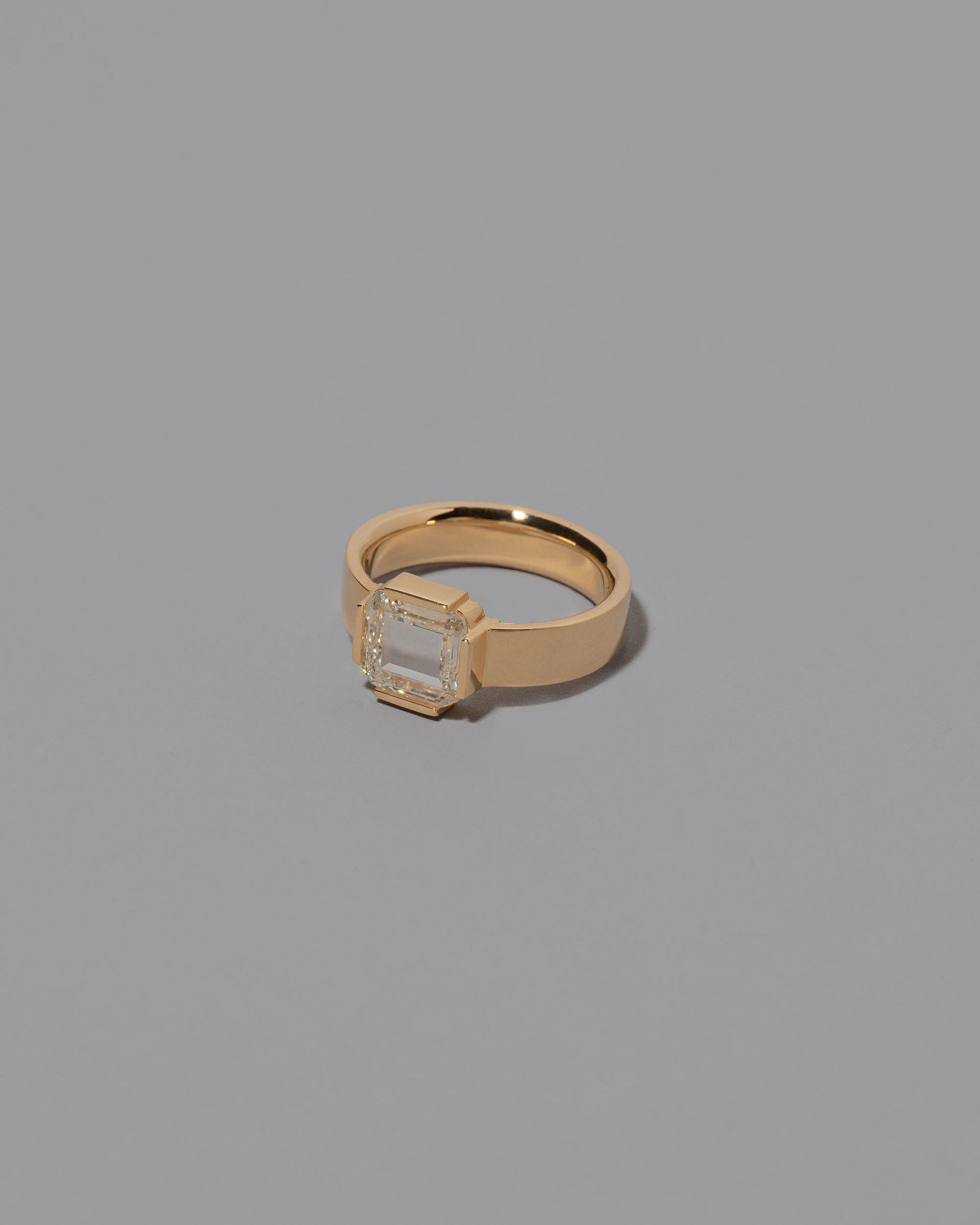 View from the side of the Flatten Ring on grey color background.