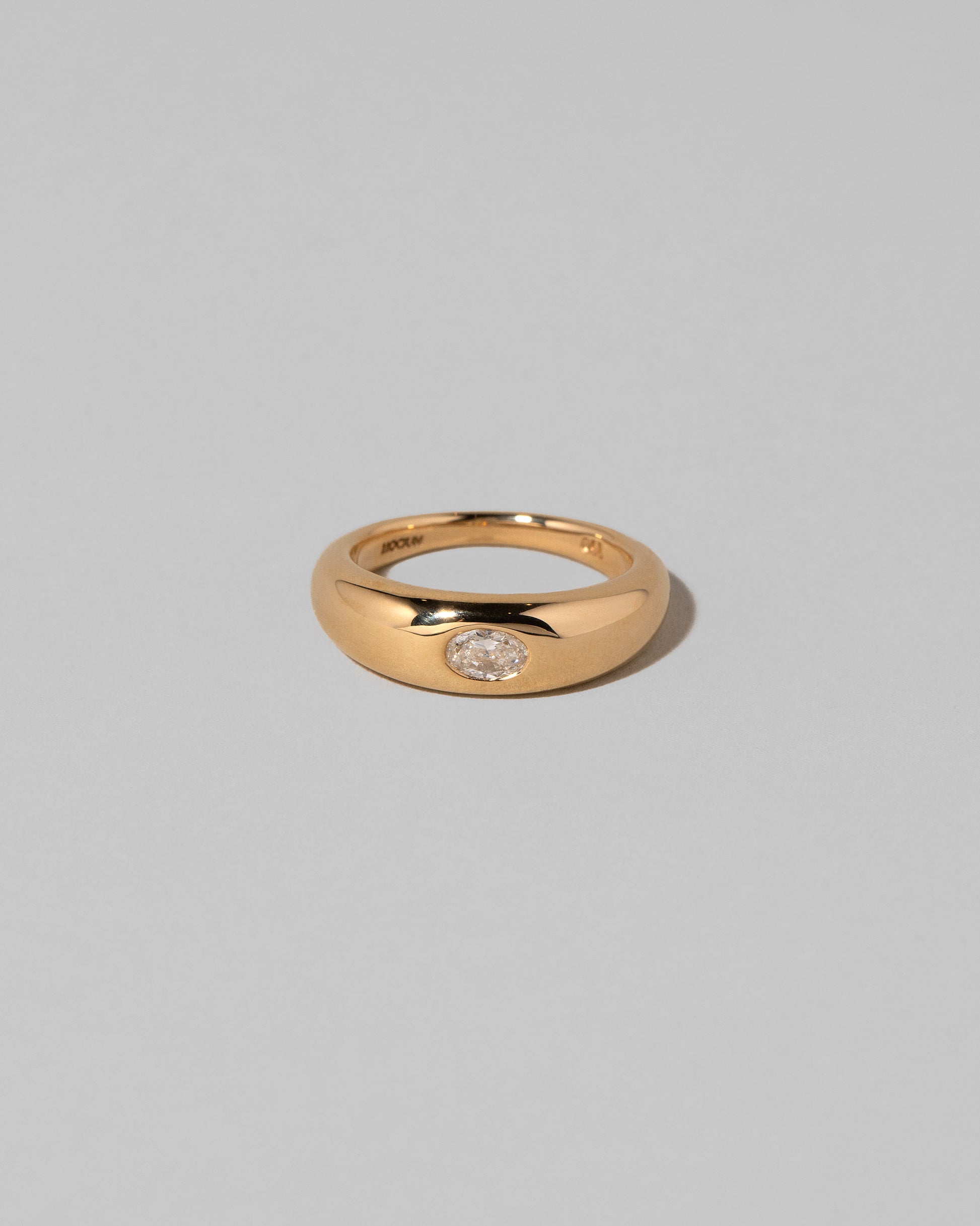 Diamond Venus Ring on light color background.