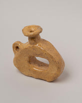 Closeup details of the Willem van Hooff Clay Tiny Core Vessel on light color background.