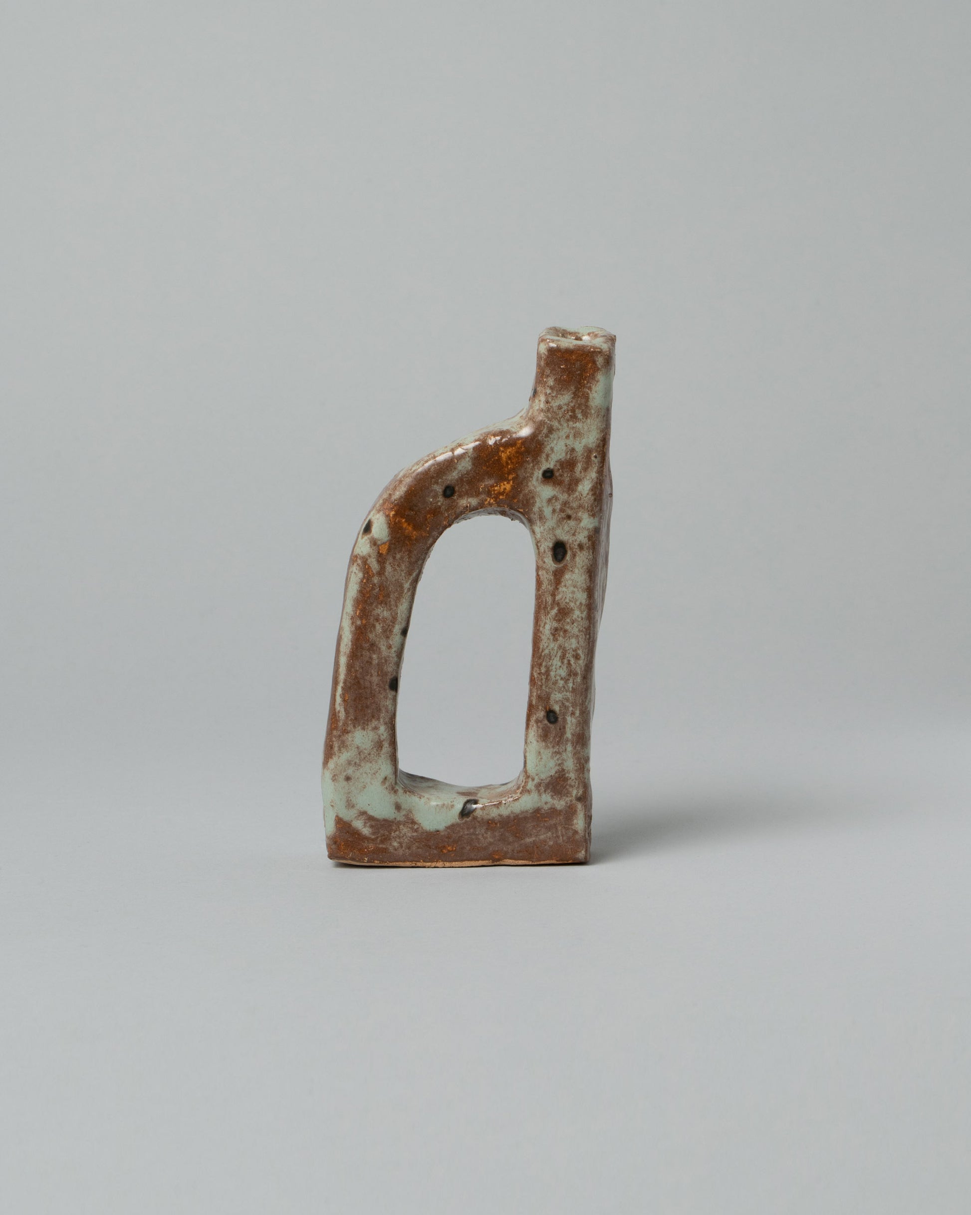 Willem van Hooff Rust Tiny Core Vessel on light color background.