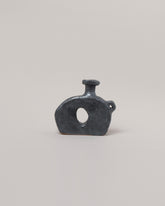 Willem van Hooff Iridium Tiny Core Vessel on light color background.