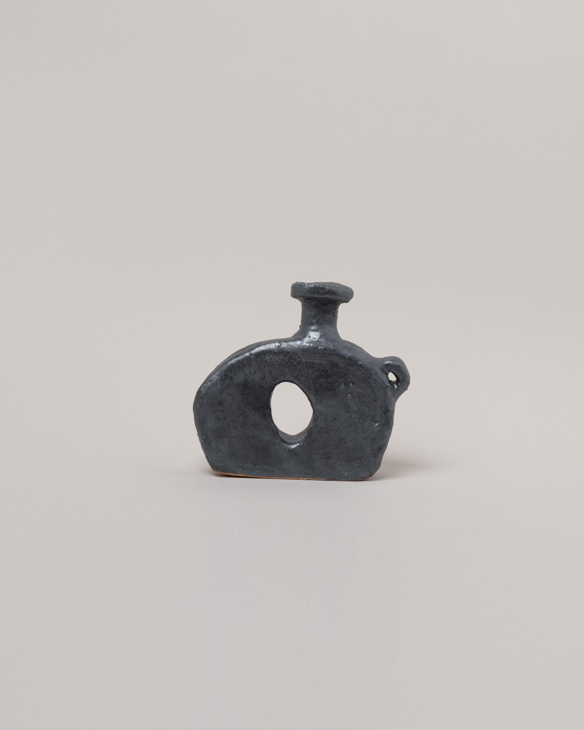 Willem van Hooff Iridium Tiny Core Vessel on light color background.