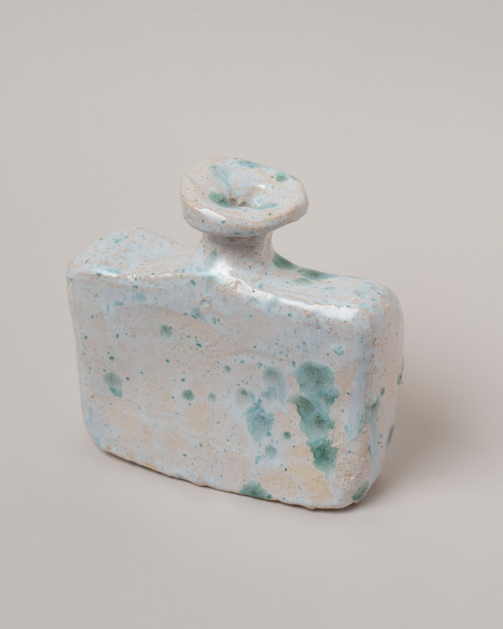 Closeup details of the Willem van Hooff Oxley Tiny Core Vessel on light color background.