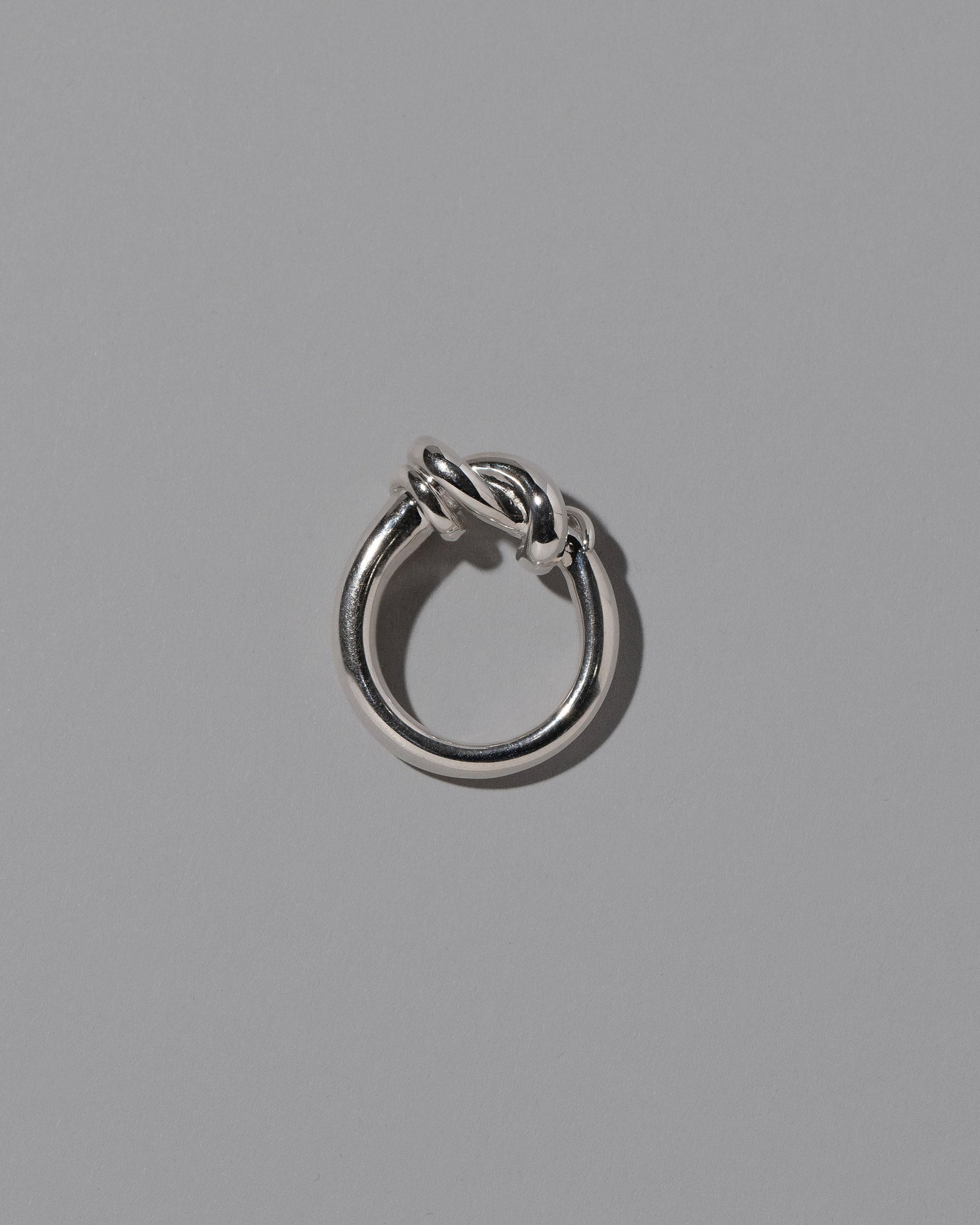 View from the side of the CRZM Sterling Silver Ridge Ring on light color background.