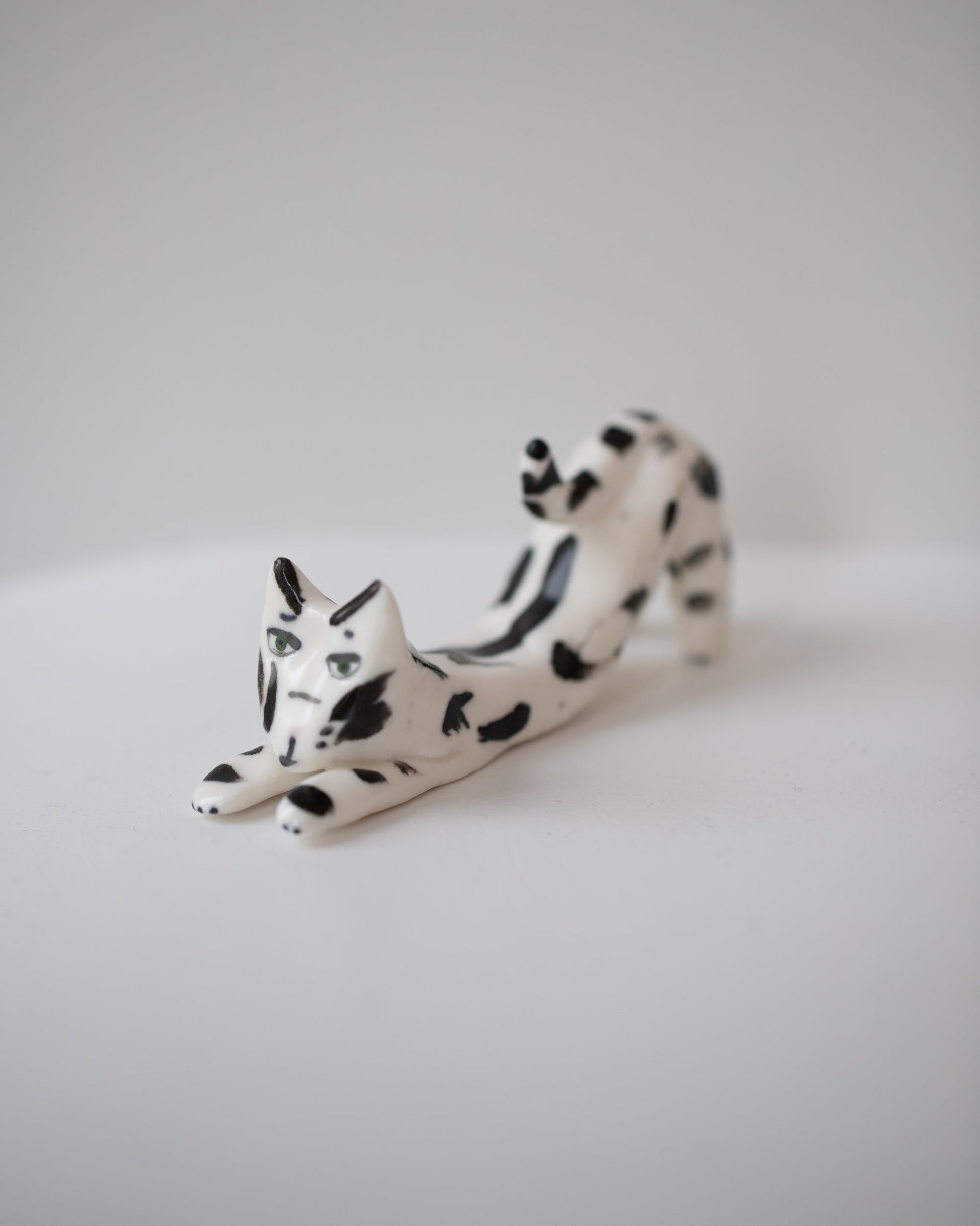 Eleonor Boström Black Spots Cat Ring Holder on light color background.