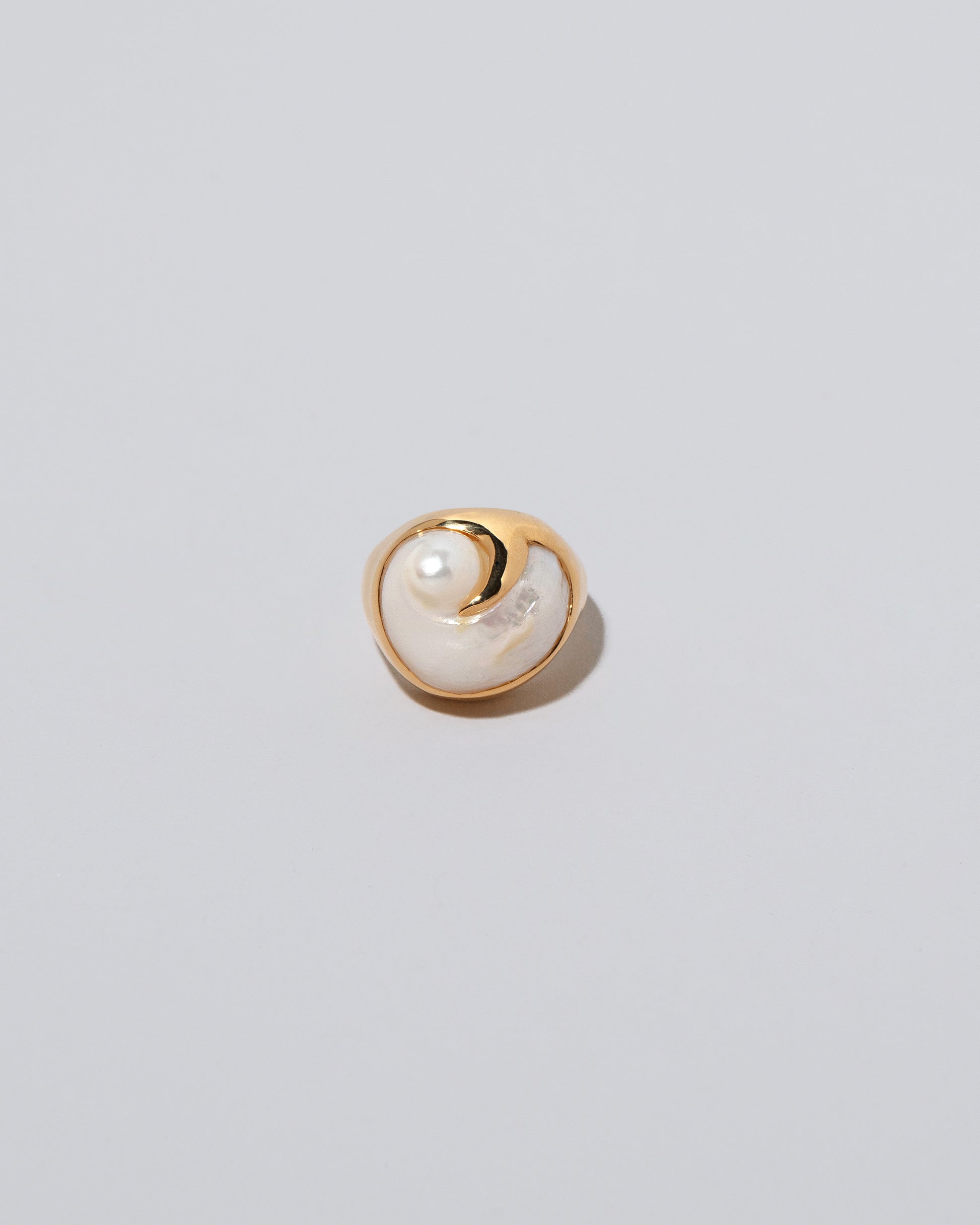 Ibis Pearl Ring on light color background.