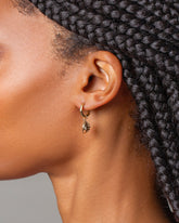 Steamed Dumpling Charm with Segmented Hoop Earrings on model.