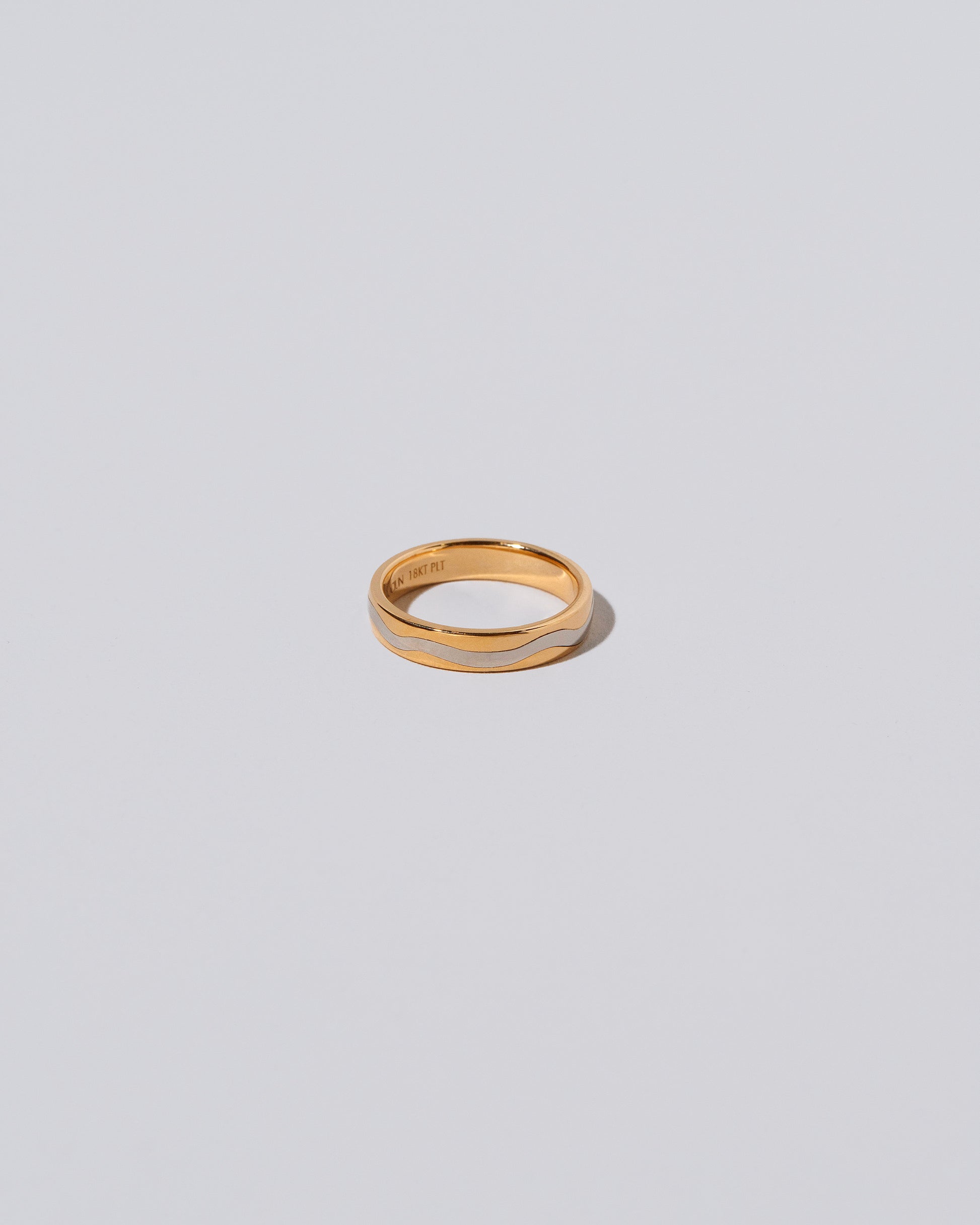 4mm Yellow 18K Outside and Platinum Inside Swimming Pool Band on light color background.