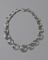 CRZM Sterling Silver Serpentinite Necklace on light color background.