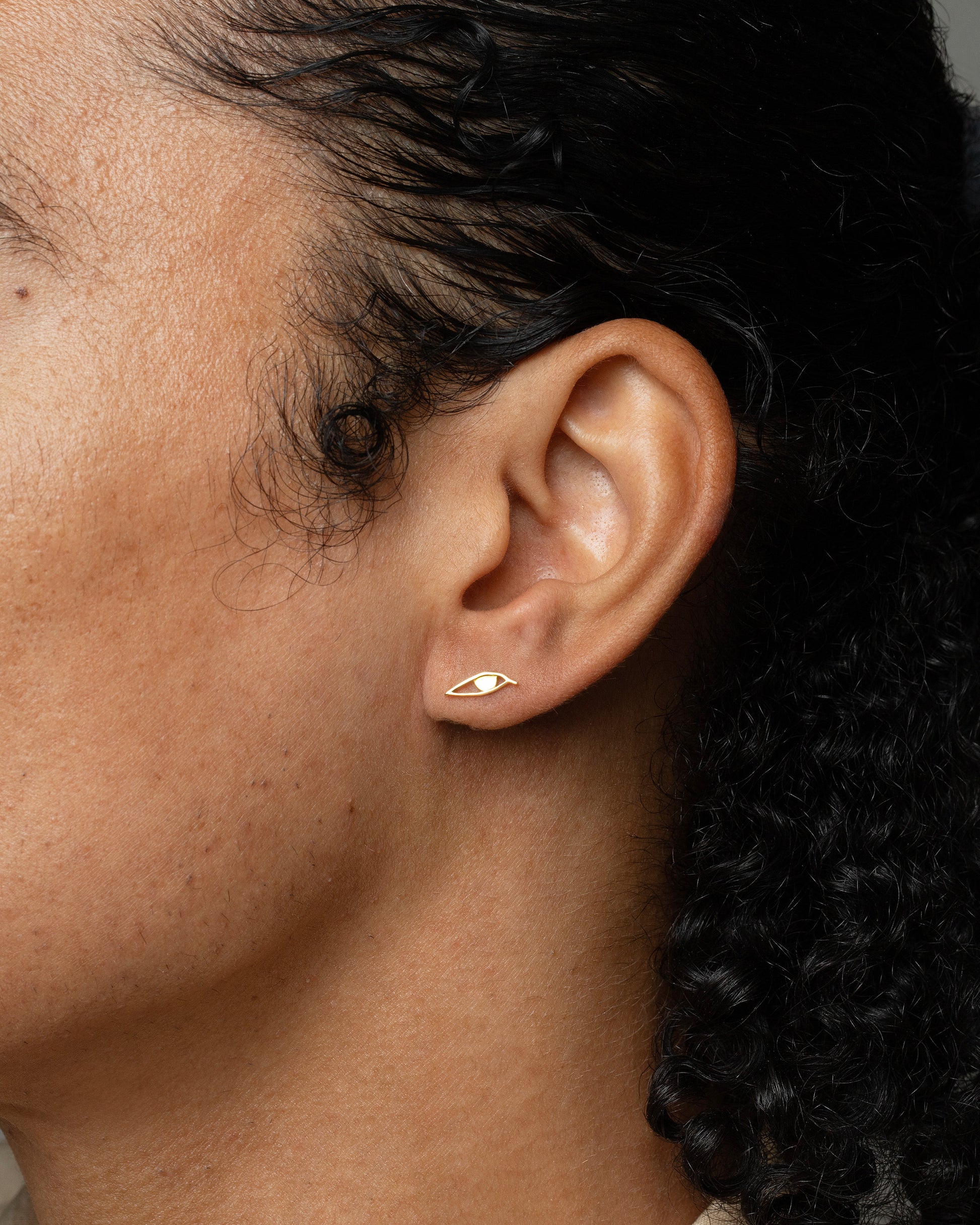 Right Eye Stud Earring Single worn on the left ear on model.