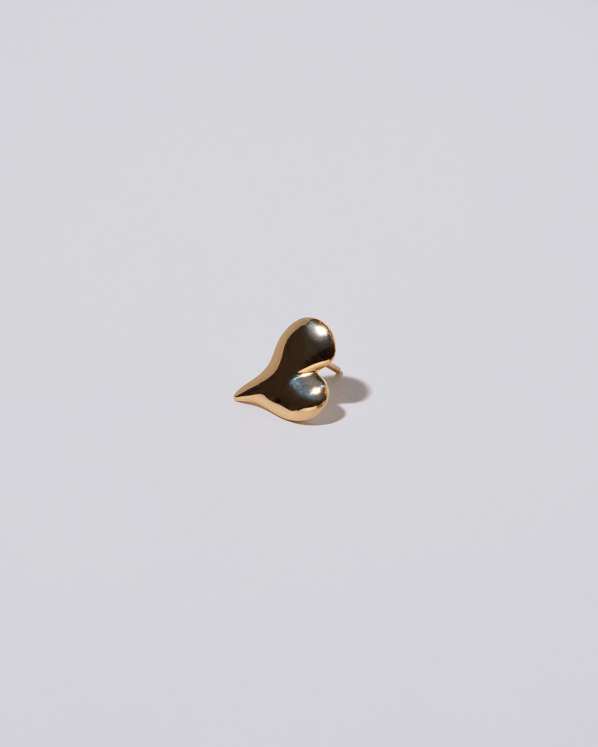 Thousand & One Night Heart Stud Earrings on light color background.