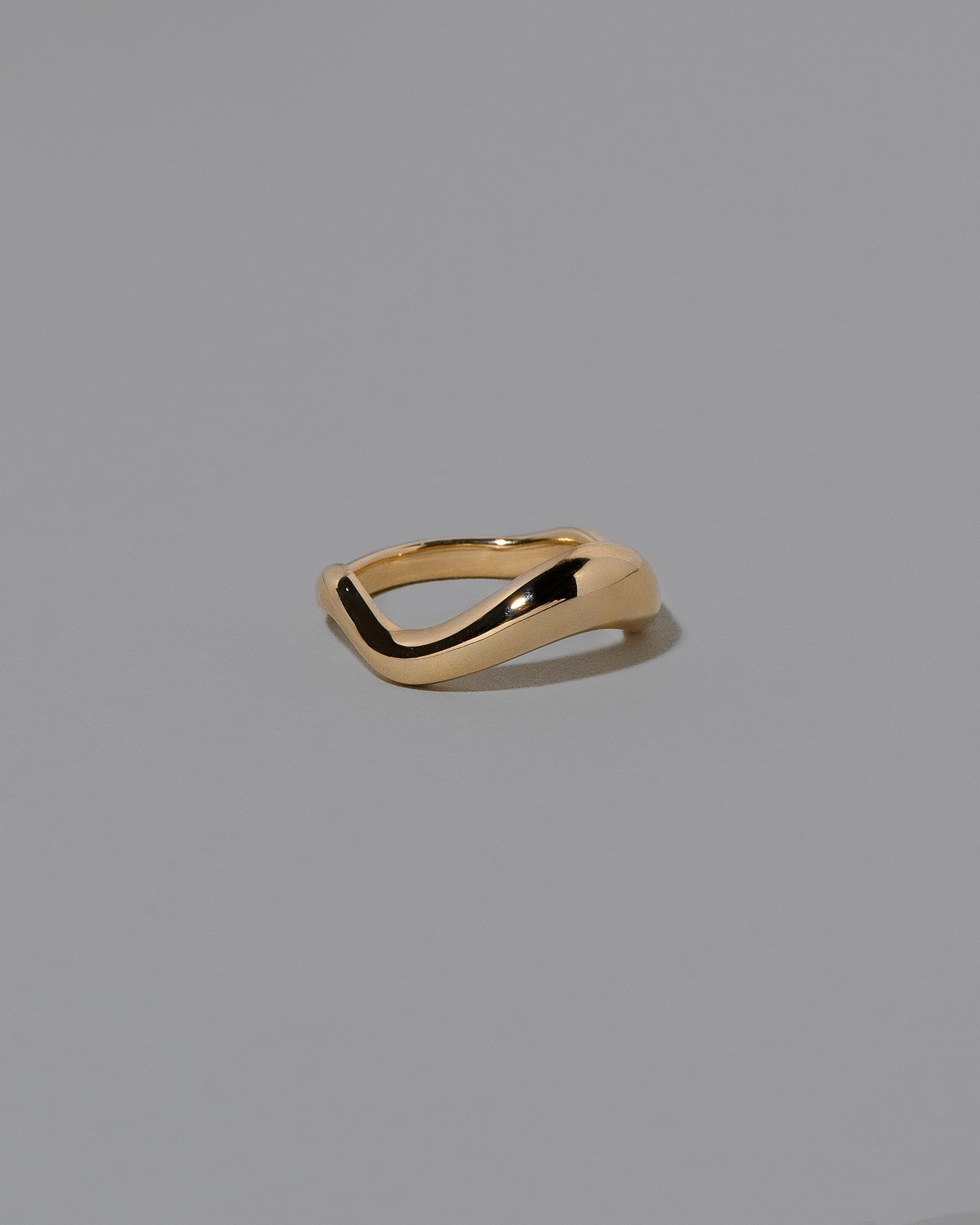 View from the side of the Gold Equate Band on light color background.