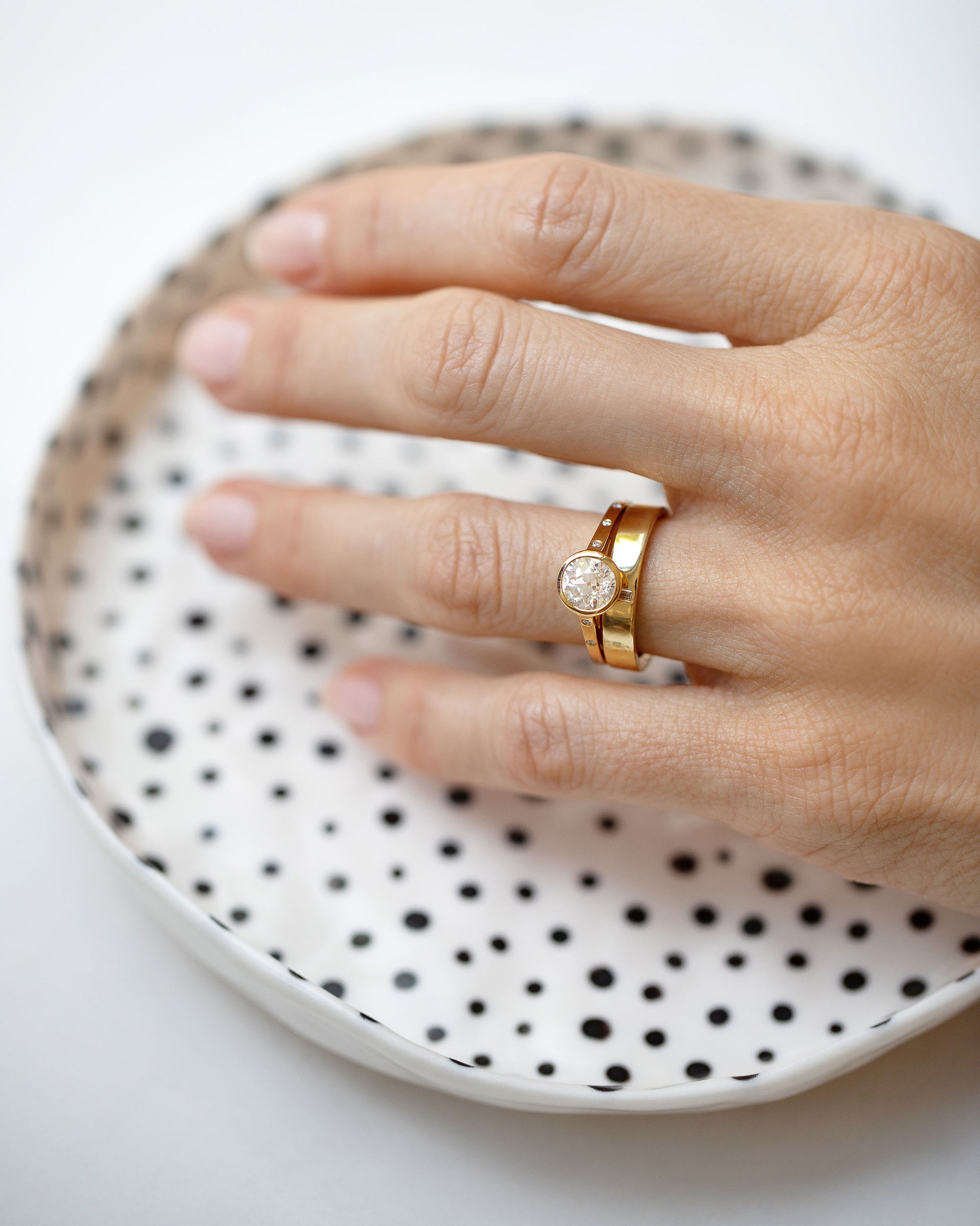 Diamond Calatrava Ring and Gold Diamond North South 4mm Baguette-Set Piet Band on model.