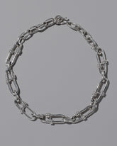 CRZM Sterling Silver Canyon Necklace on light color background.