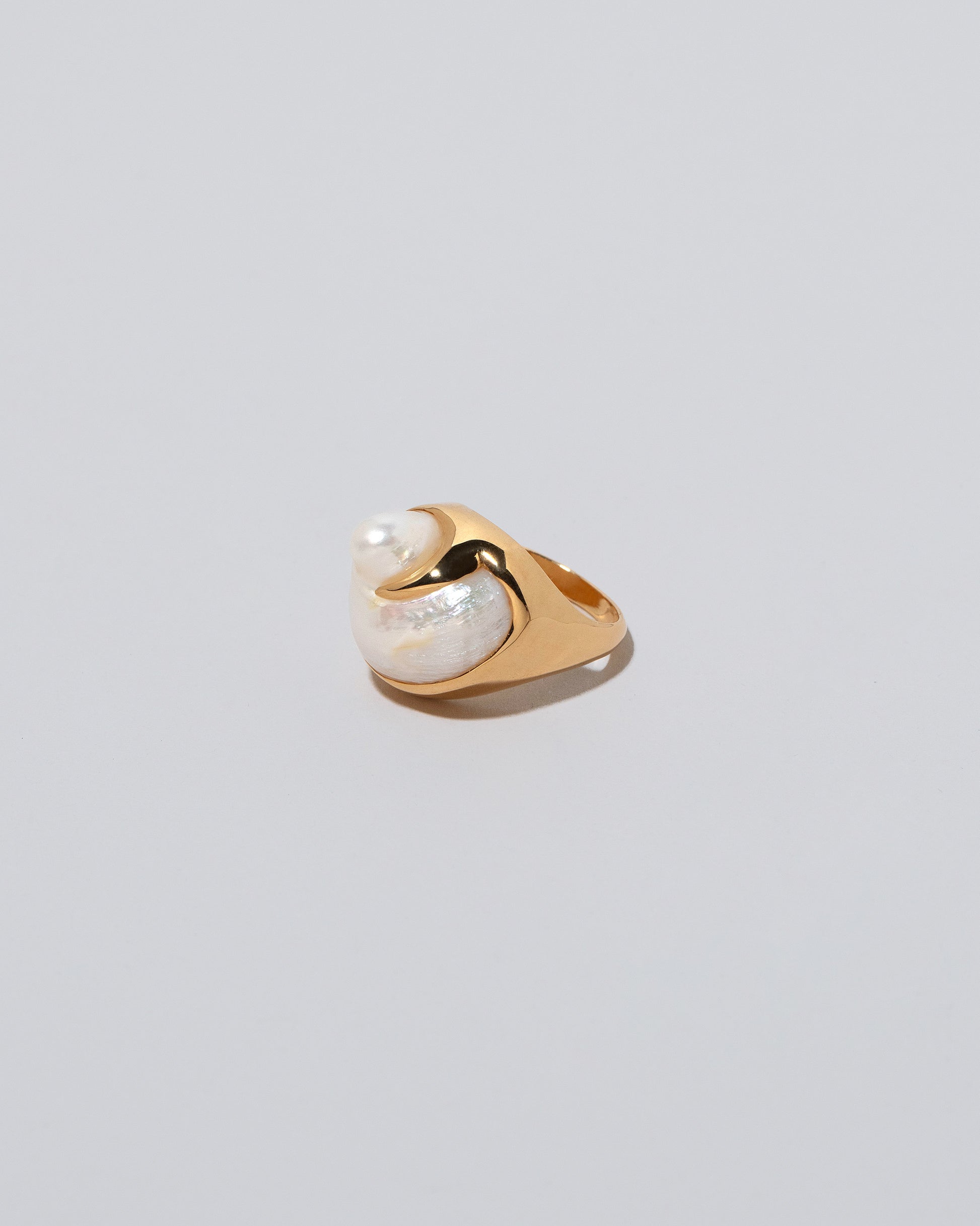 Ibis Pearl Ring on light color background.