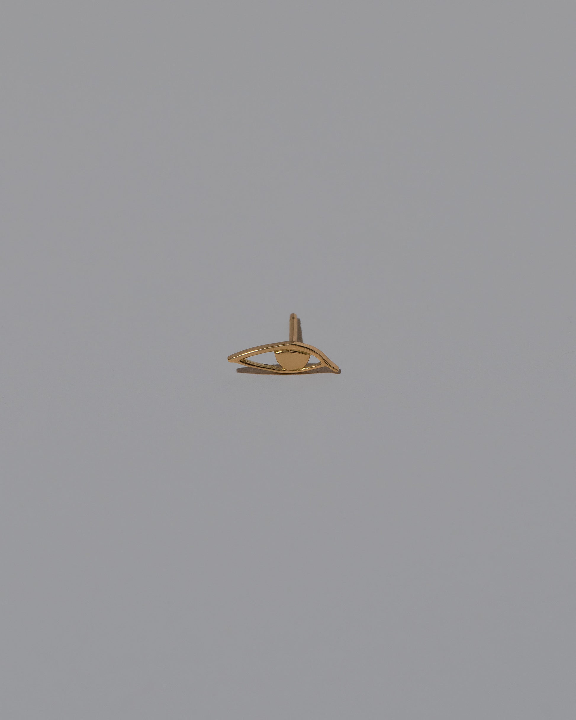 Right Eye Stud Earring Single on light color background.