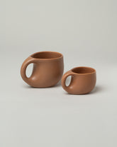 Dust and Form Small Maple Comfort Mug and Dust and Form Large Maple Comfort Mug on light color background.