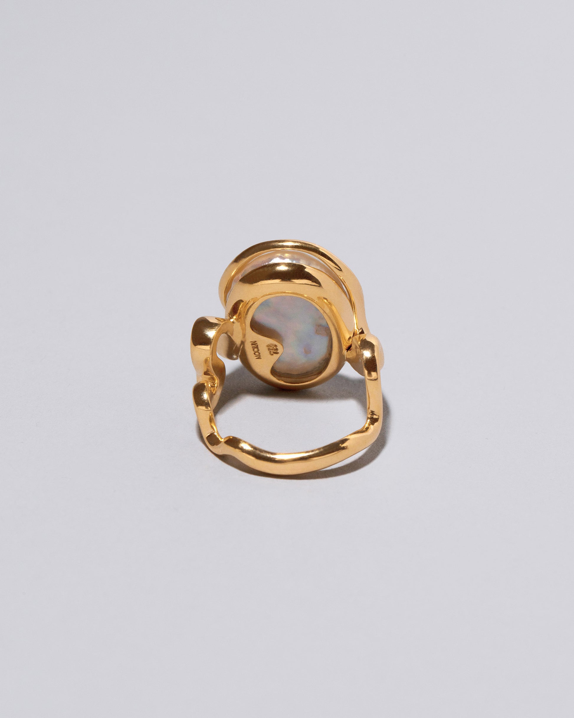 View from the side of the Weaver Ring on light color background.