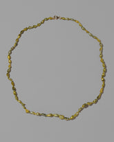 Karkinos Necklace on light color background.