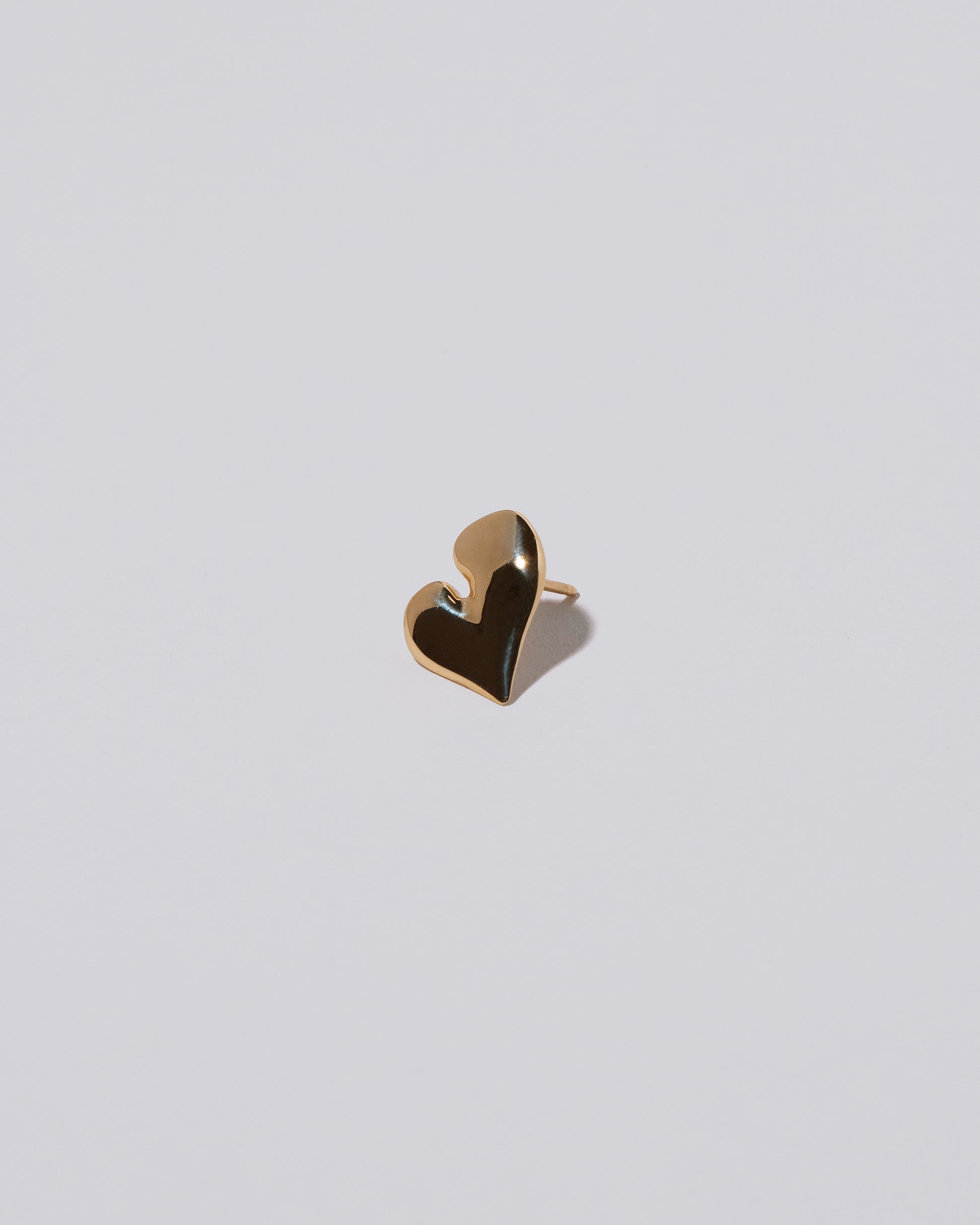 Thousand & One Night Heart Stud Earrings on light color background.