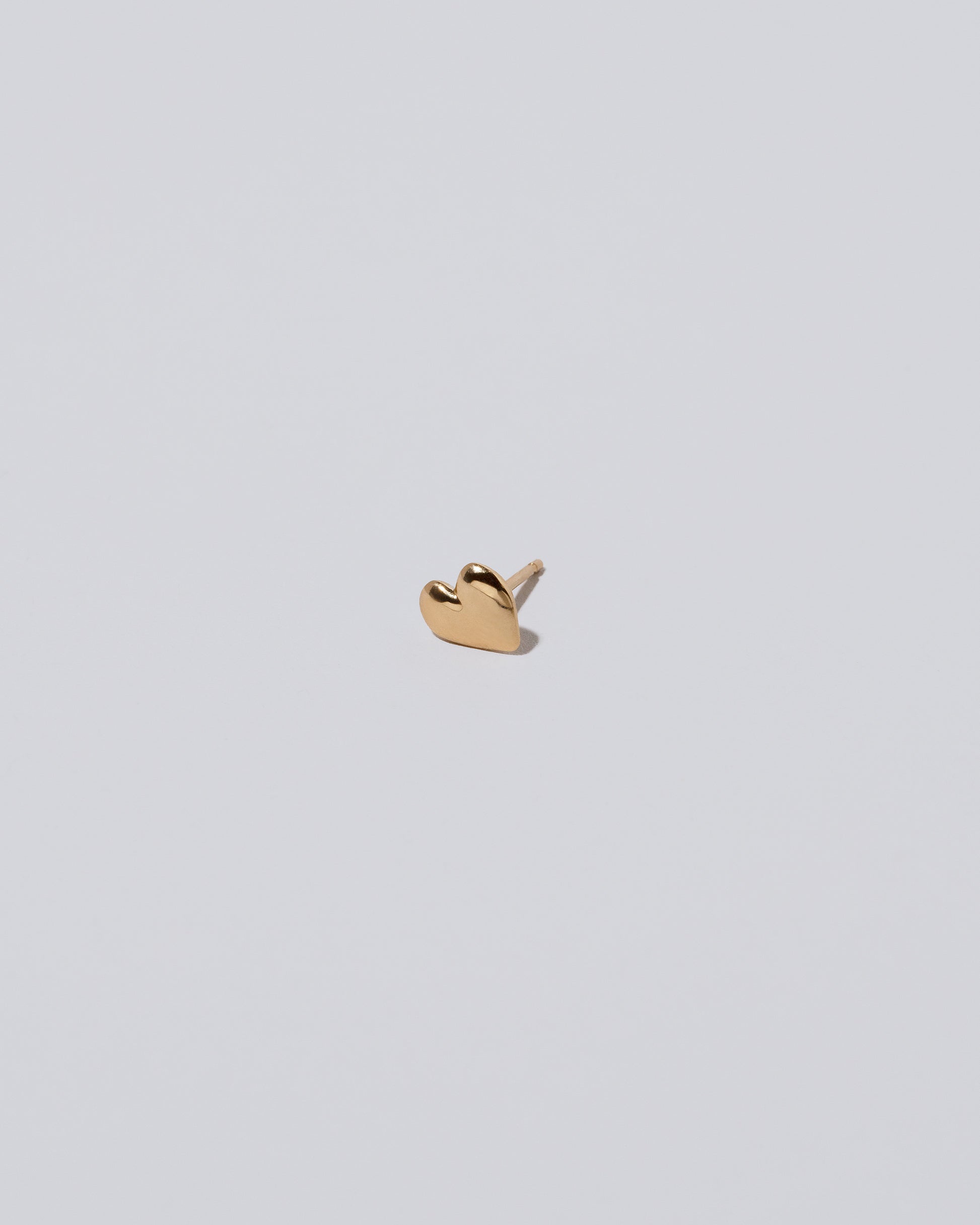 Shape One Small Thousand & One Night Heart Stud Earring single on light color background.