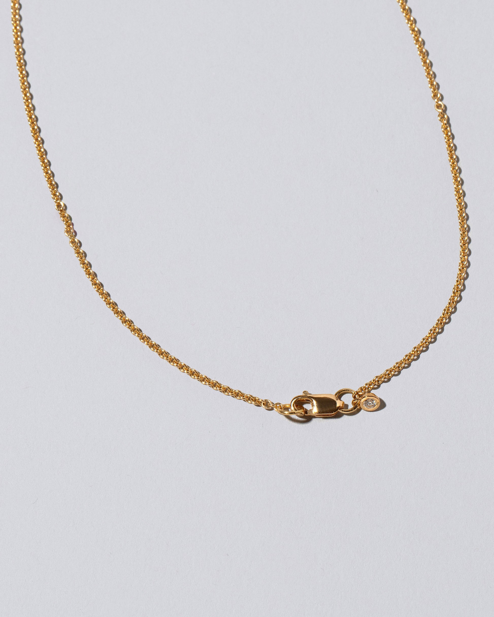 View from the back of the Shah Necklace on light color background.