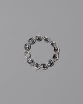 CRZM Sterling Silver Medium Bedrock Bracelet on light color background.