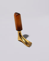 Carl Auböck Brass Foot Corkscrew on light color background.