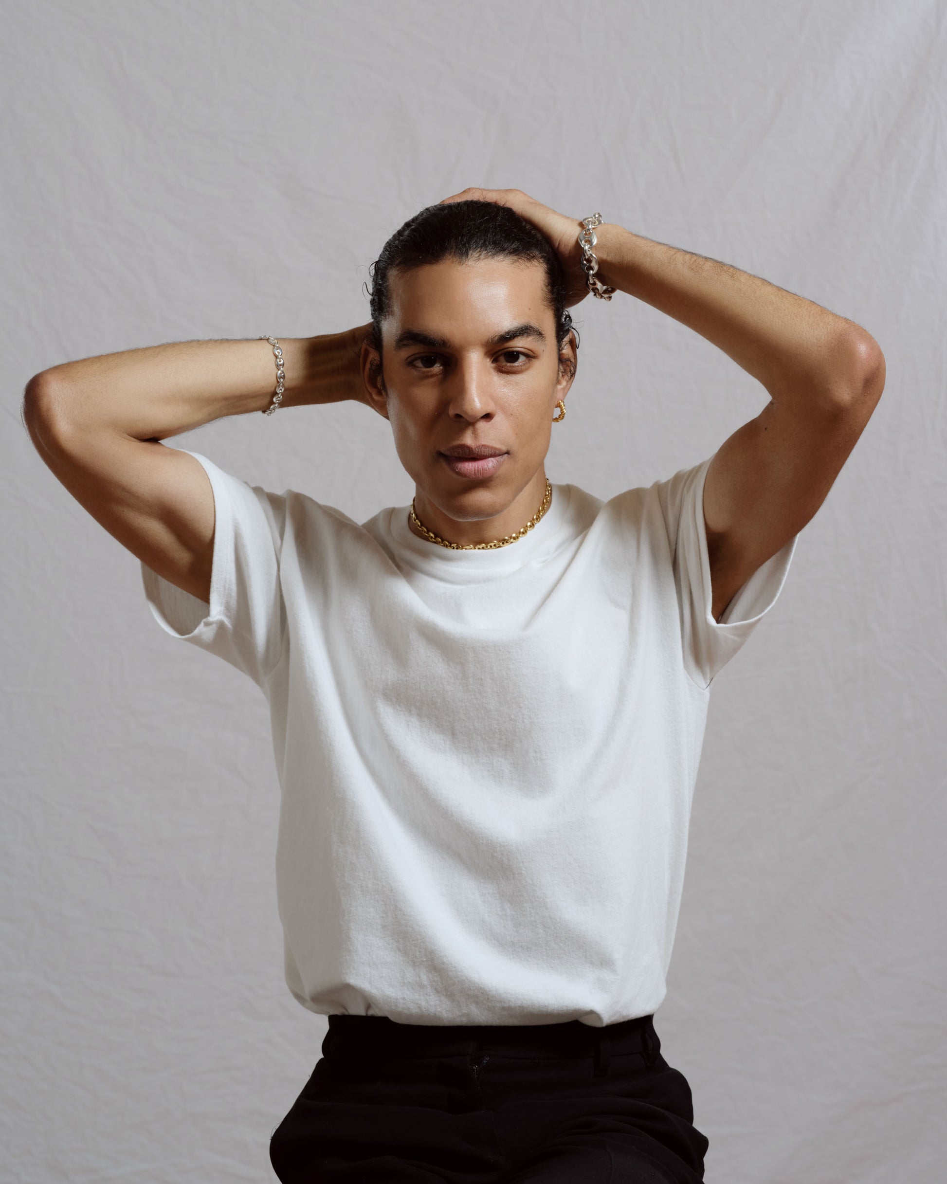 Styled image featuring CRZM jewelry on model.