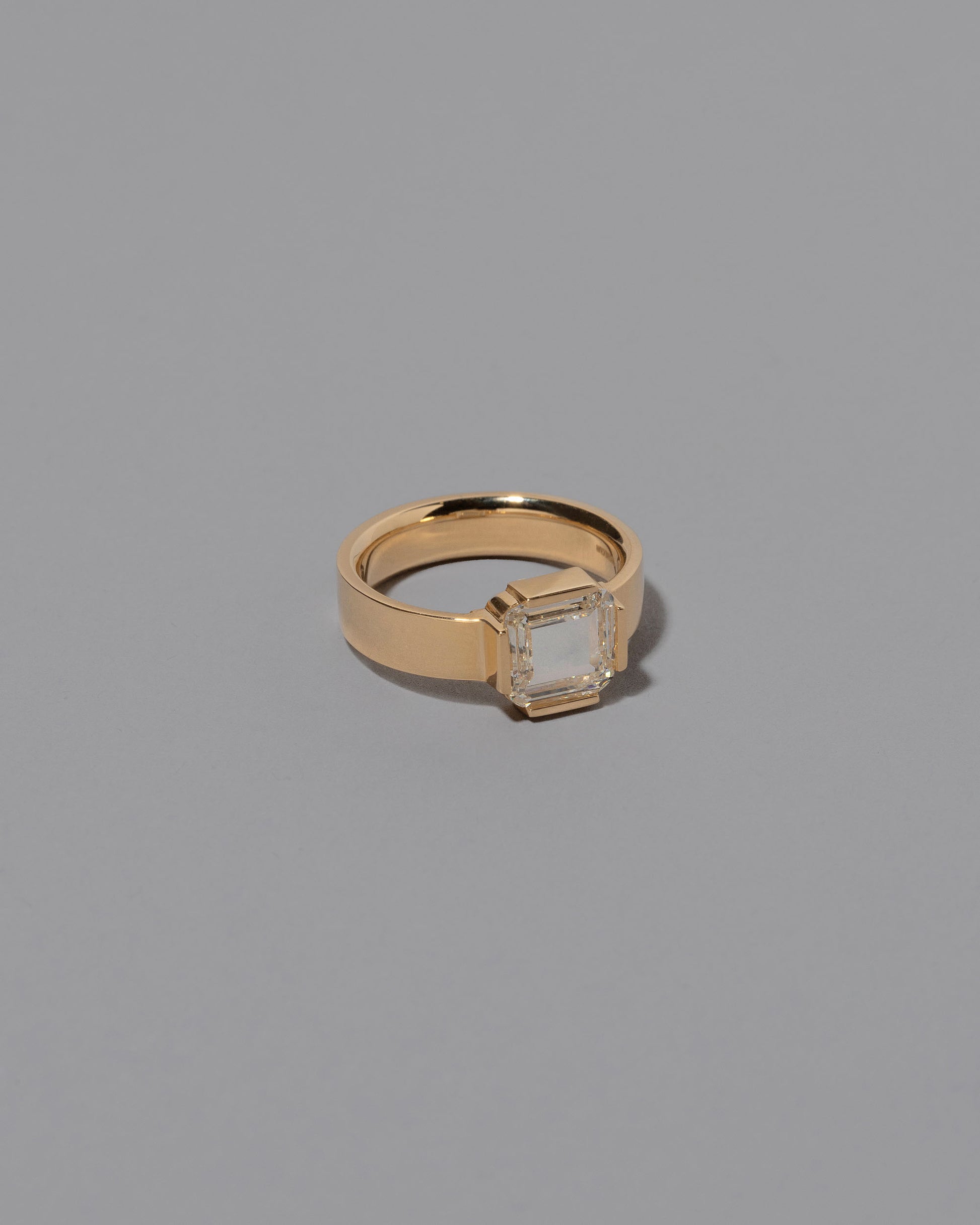 View from the side of the Flatten Ring on grey color background.