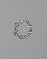 CRZM Sterling Silver Serpentinite Bracelet on light color background.