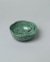 Recreation Center Green Speckle Flower Bowl on light color background.