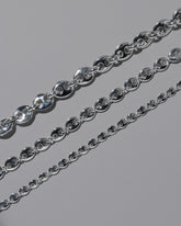 Closeup details of the CRZM Sterling Silver Bedrock Mini Bracelet, Sterling Silver Bedrock Medium Bracelet, and Sterling Silver Bedrock Bracelet on light color background.