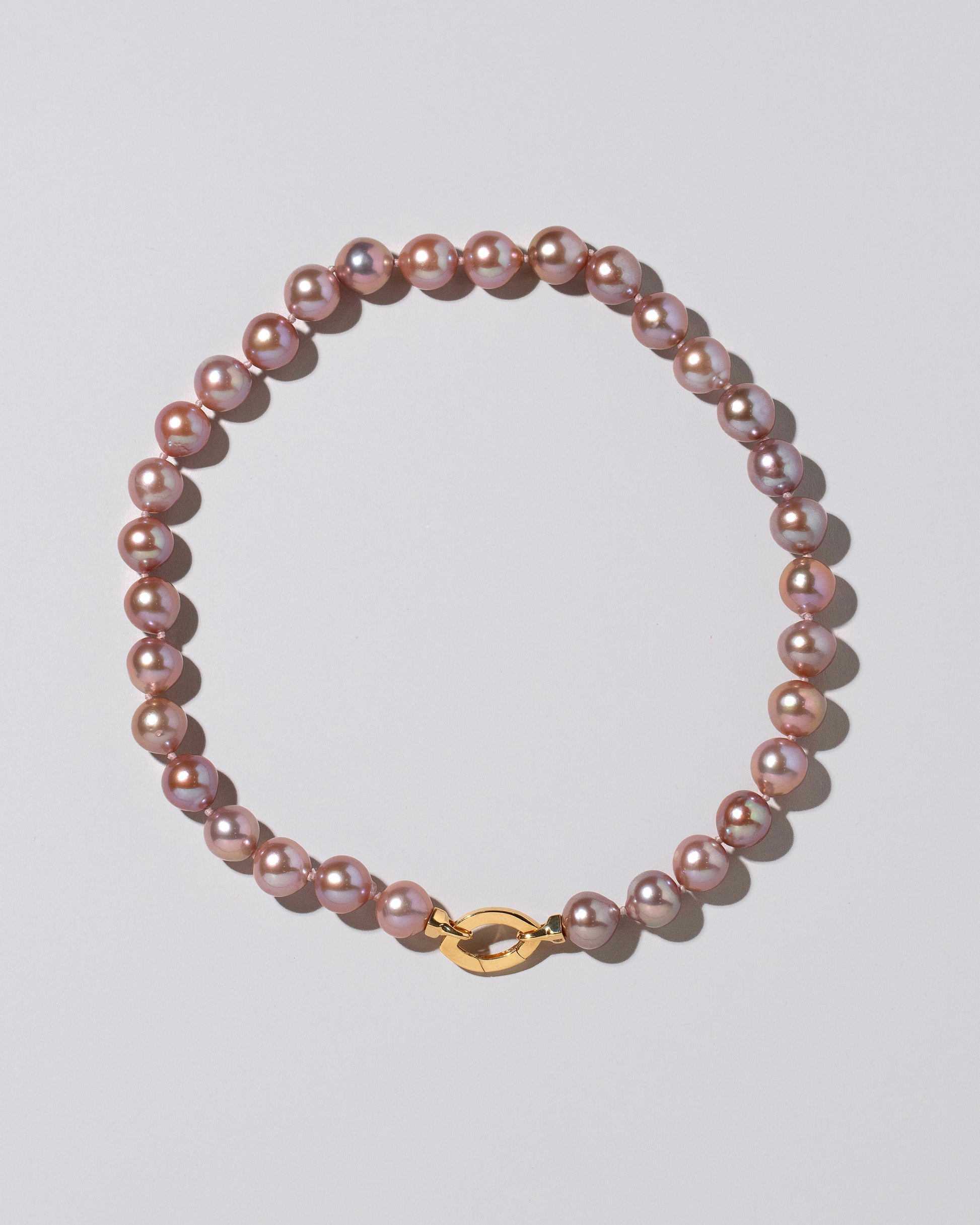 Cormorant Pearl Necklace on light color background.