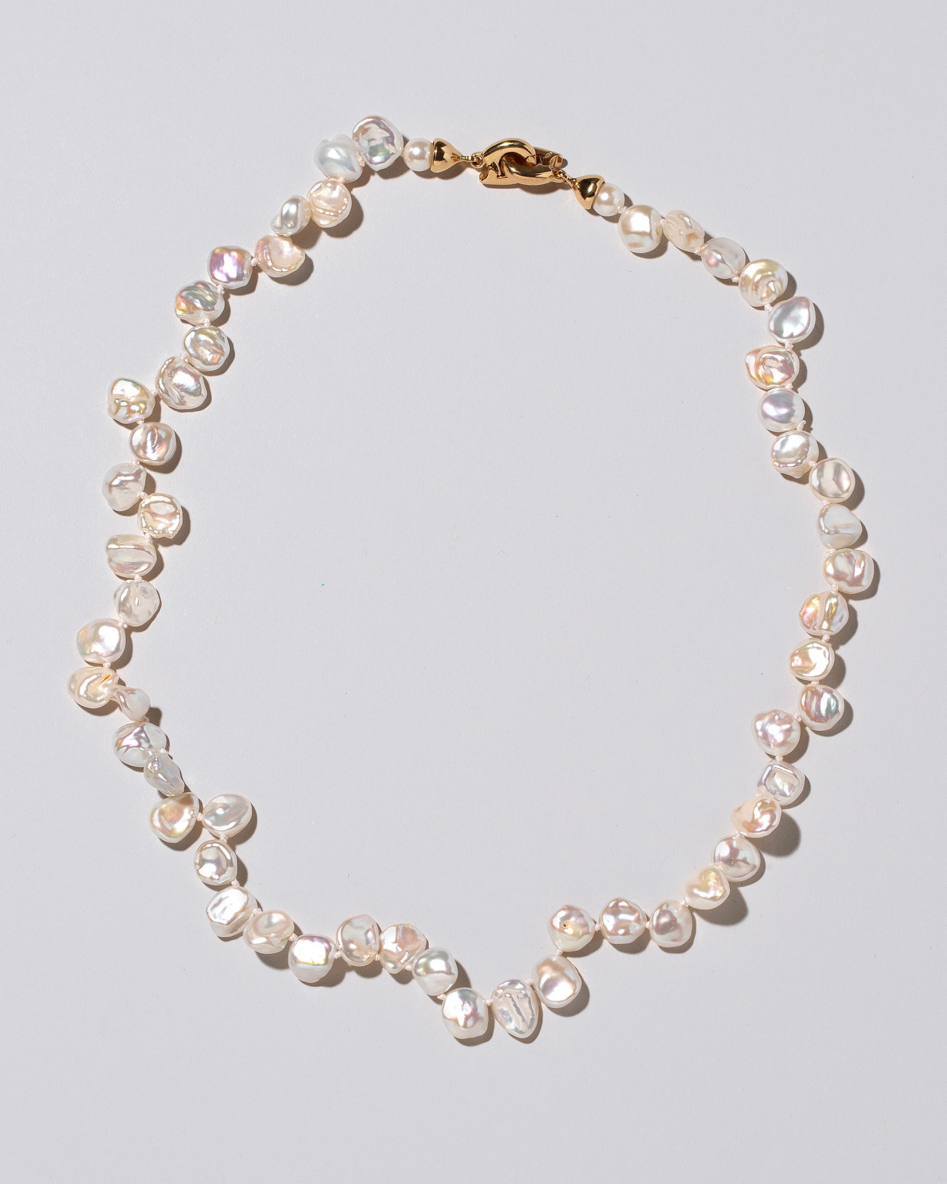 Tern Pearl Necklace on light color background.