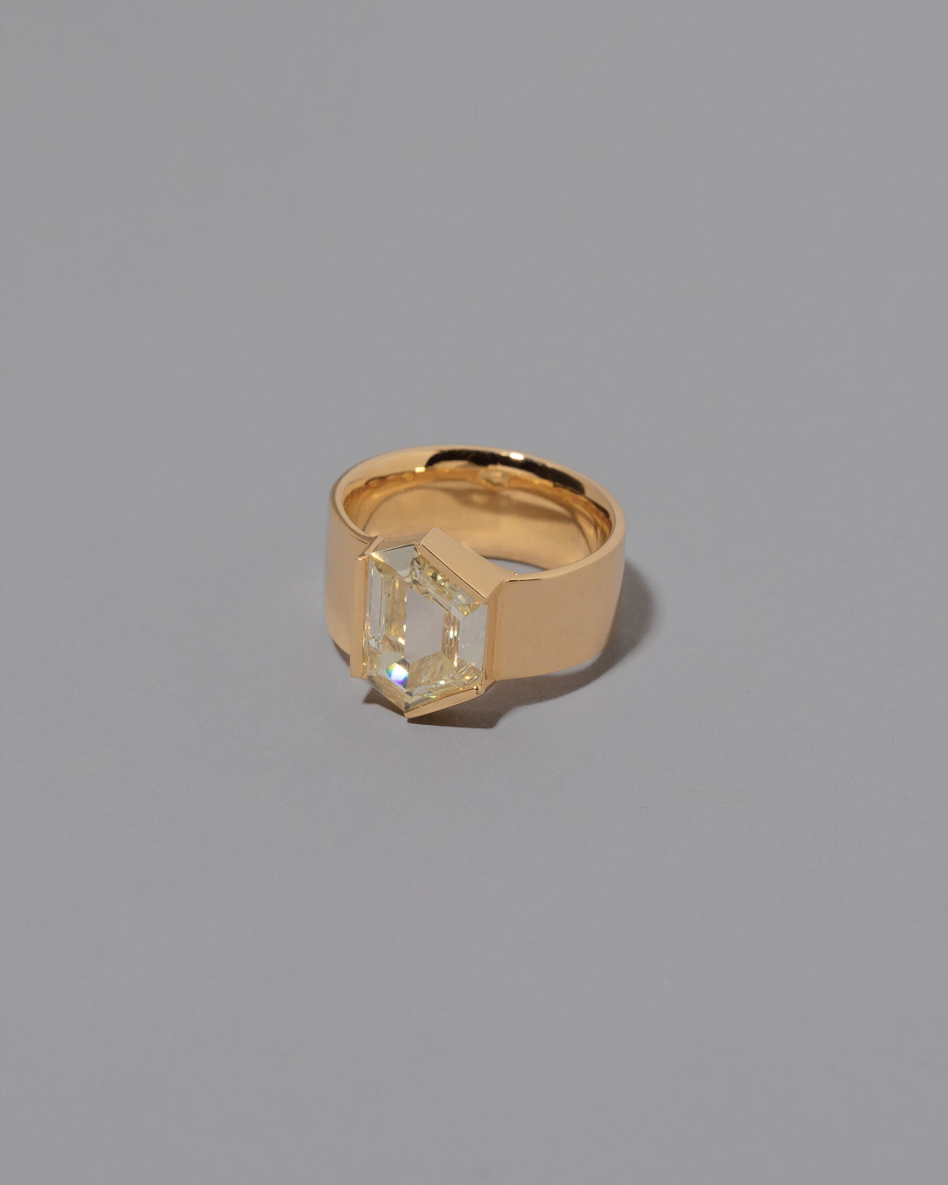 View from the side of the Wrap Ring on grey color background.